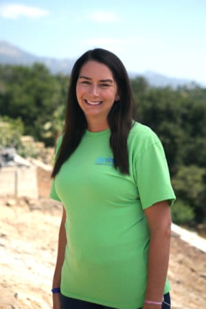 A woman wearing a green shirt.
